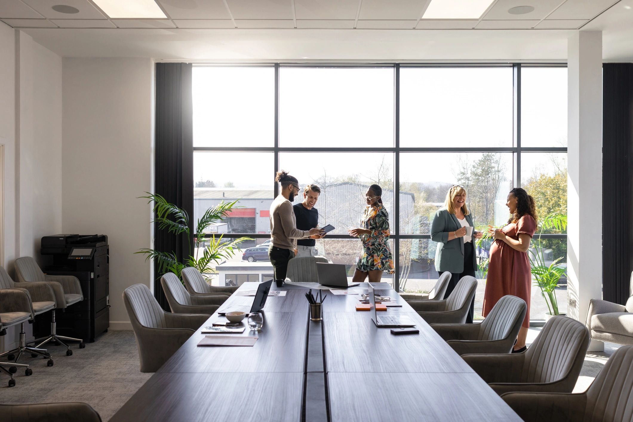 Amitech Group team discussion in a professional office